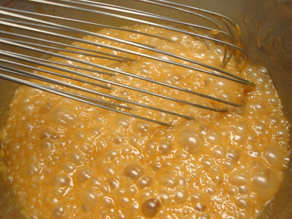 adding cream to caramel