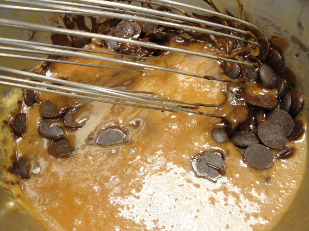 adding chocolate to caramel mixture